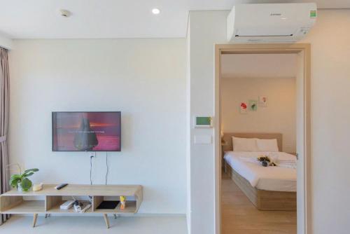 Кровать или кровати в номере The Song Vung Tau Bi Homestay & Spa