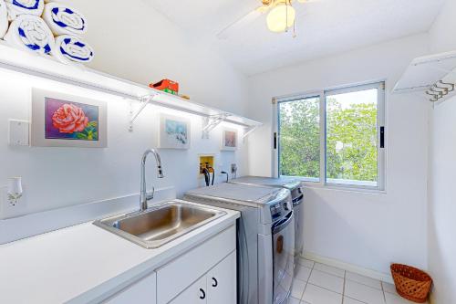 a kitchen with a sink and a dishwasher at Plein Air Point in Marathon