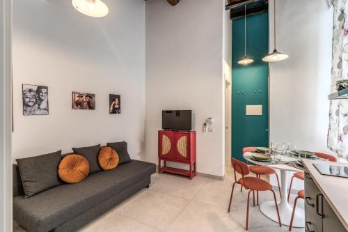 a living room with a couch and a table at NextStopPignasecca in Naples