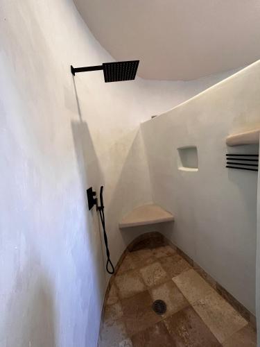 a stairway with a light on the wall and a stairsuggest at Villas Cononda in La Majahua
