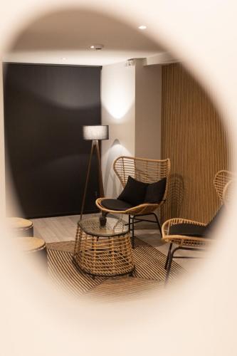 a room with chairs and a lamp and a table at Filoxenia Hotel & Spa in Kalavrita