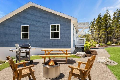 a backyard with a picnic table and a grill at 37b Orchard Hills Circle in Bernard