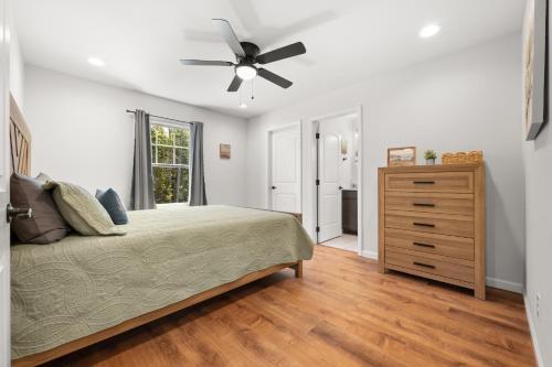 a bedroom with a bed and a ceiling fan at 37a Orchard Hills Circle in Bernard