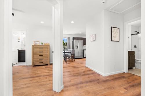 an open living room with white walls and wood floors at 37a Orchard Hills Circle in Bernard