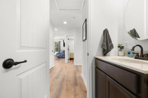 a white bathroom with a sink and a door at 37b Orchard Hills Circle in Bernard