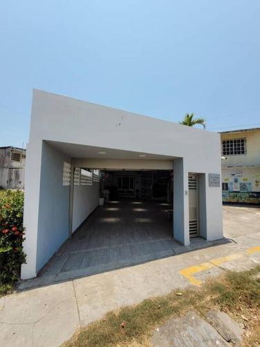 a large white building with a parking lot at casa en veracruz in Veracruz