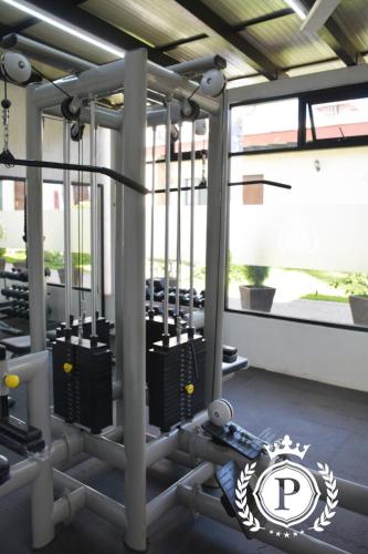 a room with a gym with rows of machines at Hotel Posada Virreyes in Guadalajara