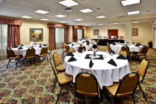 a conference room with tables and chairs in it at Holiday Inn Hotel & Suites Ann Arbor University of Michigan Area by IHG in Ann Arbor