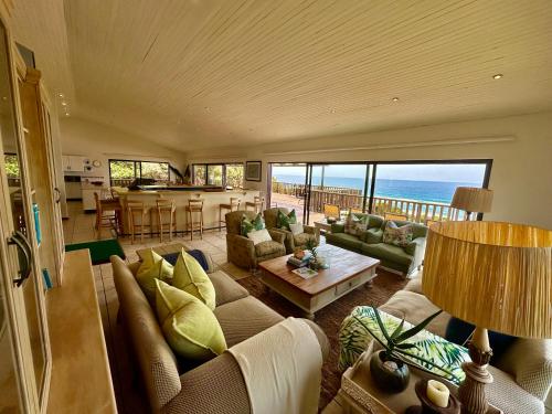 a living room with a couch and a table at Kangela 1 in Ponta Malongane