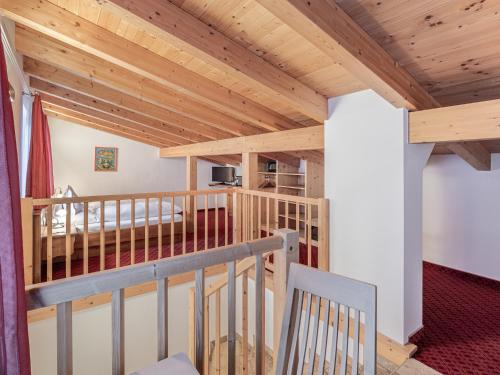 a staircase in a house with wooden ceilings at Haus Annakogl und Haus Barbara in Obergurgl