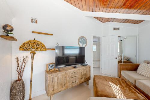 a living room with a tv and a couch at Summerland Canal in Summerland Key