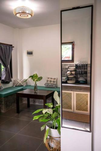 a living room with a table and a couch at Watergate Villa- Siargao Island in General Luna
