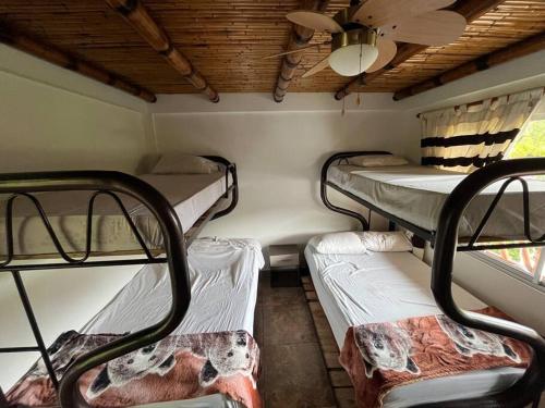 Una cama o camas en una habitación de Finca Leito