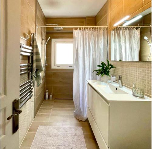 a bathroom with a sink and a window at Central loft apartments in Santa Pola