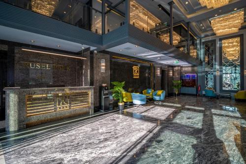a lobby of a hotel with a reception desk at Rusel Park Residence in Bahcesehir