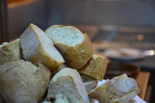 a pile of bread sitting on top of a plate at Hotel Posada Virreyes in Guadalajara