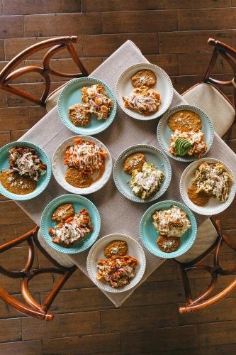 a bunch of plates of food on a table at Hotel Posada Virreyes in Guadalajara