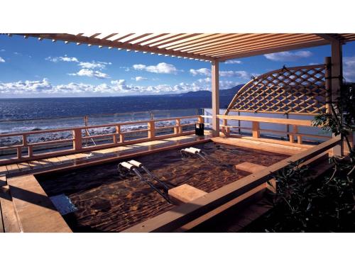 a hot tub on the beach with the ocean in the background at Inatori Tokai Hotel Yuen - Vacation STAY 31868v in Inatori