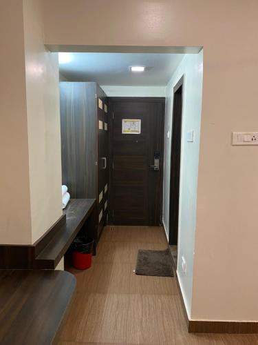 a hallway of a hotel room with a door at Hotel Rituraj in Guwahati