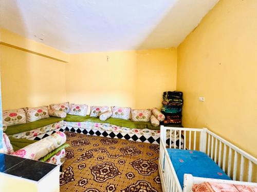 a room with a bed and a couch in a room at Magic View in Bine el Ouidane