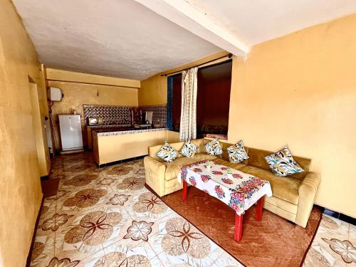 a living room with a couch and a table at Magic View in Bine el Ouidane