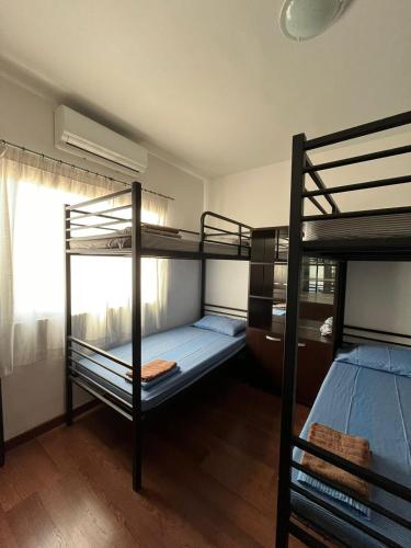 Postel nebo postele na pokoji v ubytování Jopa Sorority