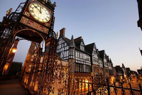 a large clock tower in front of a building at Chester City Centre Town House in Chester