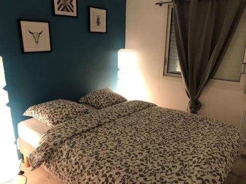 Katil atau katil-katil dalam bilik di Appartement 4 personnes à Arcachon