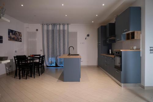 a kitchen and dining room with a table and chairs at B & B Replay in Perugia
