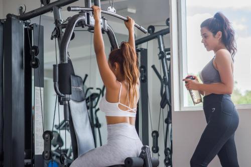two women in a gym working on a simulator at Riosol Hotel Tarapoto in Tarapoto