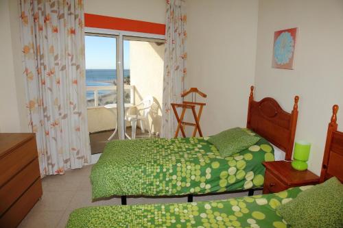 A bed or beds in a room at JSM Apartamentos