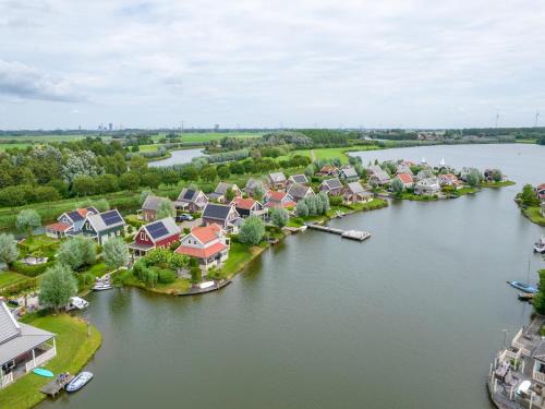 an aerial view of a village on a river at Bungalow by Water near Rotterdam in Simonshaven