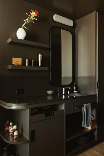 a bathroom with a sink and a mirror at Populus in Denver