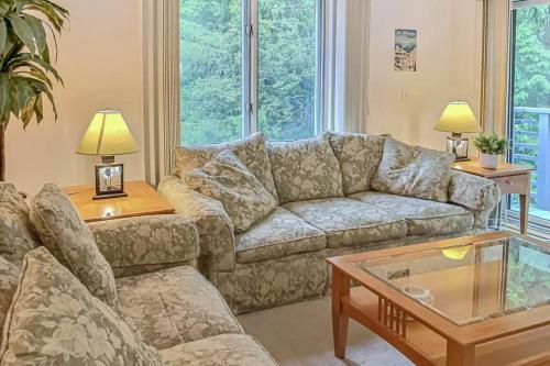 a living room with a couch and a coffee table at The Woods - Village-40 in Killington