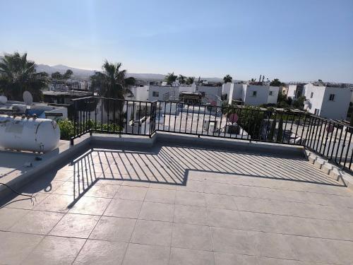 a view of a balcony with a fence and stairs at Casa Tezal Alberca in Cabo San Lucas
