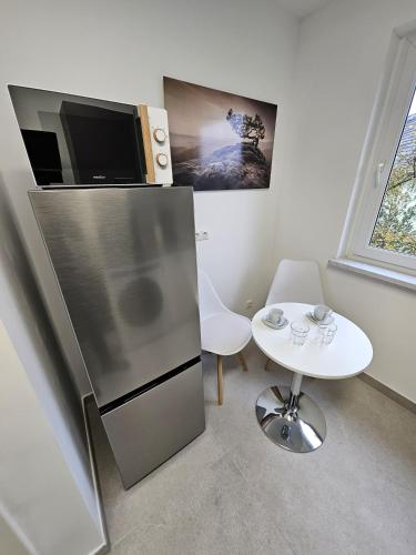 Η κουζίνα ή μικρή κουζίνα στο Modern Homes - Voll ausgestatte Wohnung - Balkon - Hotelbetten - 4K TV - WLAN