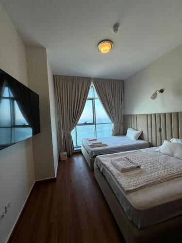 Cama o camas de una habitación en Ocean View Luxury Suites