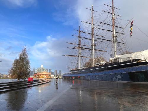 a large ship is parked next to a building at 10 Garsington Mews in London