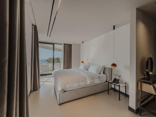 Ένα ή περισσότερα κρεβάτια σε δωμάτιο στο Zins Luxury Rooms