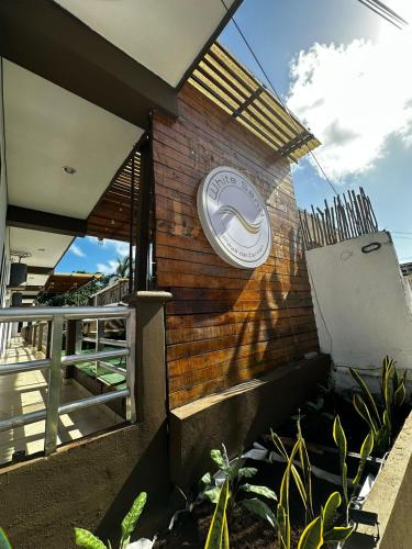 a building with a clock on the side of it at White Sand Playa in Playa del Carmen