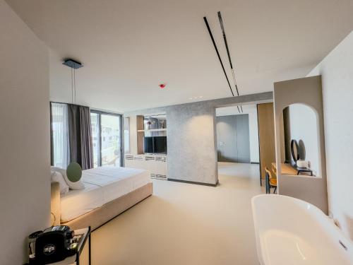 Ένα ή περισσότερα κρεβάτια σε δωμάτιο στο Zins Luxury Rooms