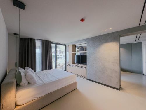 Ένα ή περισσότερα κρεβάτια σε δωμάτιο στο Zins Luxury Rooms