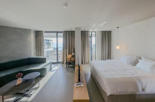 Ένα ή περισσότερα κρεβάτια σε δωμάτιο στο Zins Luxury Rooms