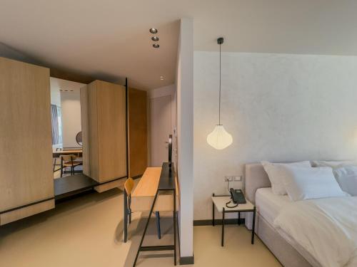Ένα ή περισσότερα κρεβάτια σε δωμάτιο στο Zins Luxury Rooms