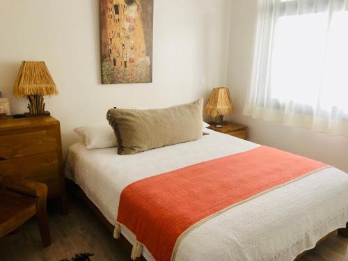 Postel nebo postele na pokoji v ubytování Chambre Manava