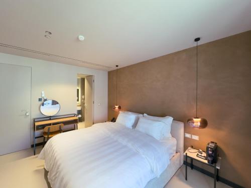 Ένα ή περισσότερα κρεβάτια σε δωμάτιο στο Zins Luxury Rooms