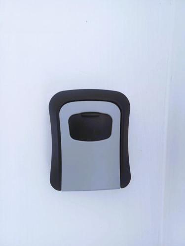 a black and white toaster on a white wall at Alappuzha Family Vacation Villa - LAYANILA in Alleppey