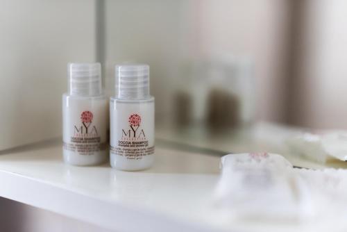 two bottles of moisturizers sitting on a counter at Garibaldi 26 in Stresa