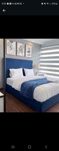 Llit o llits en una habitació de Wasi Cuenca Suites