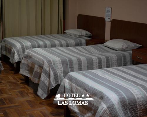 Ένα ή περισσότερα κρεβάτια σε δωμάτιο στο Hotel Las Lomas